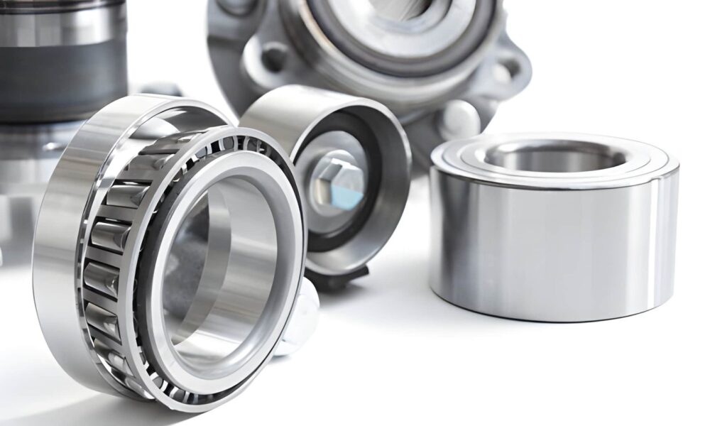 Close-up of industrial thrust bearing and ball bearing showing metal components and smooth rotation in machinery