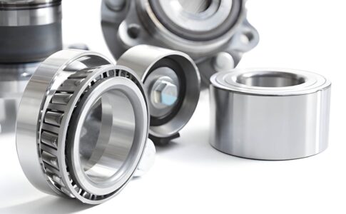 Close-up of industrial thrust bearing and ball bearing showing metal components and smooth rotation in machinery