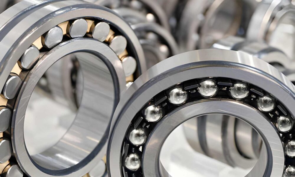 Industrial machinery maintenance concept showing bearings and spare parts used in smart planning to reduce machine downtime and improve efficiency.