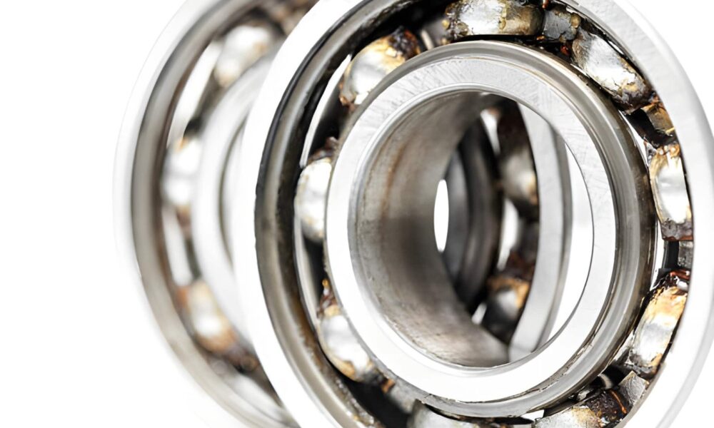 Industrial bearing system operating under high-pressure conditions showing wear prevention, lubrication, and maintenance for longer bearing life