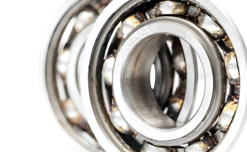 Industrial bearing system operating under high-pressure conditions showing wear prevention, lubrication, and maintenance for longer bearing life